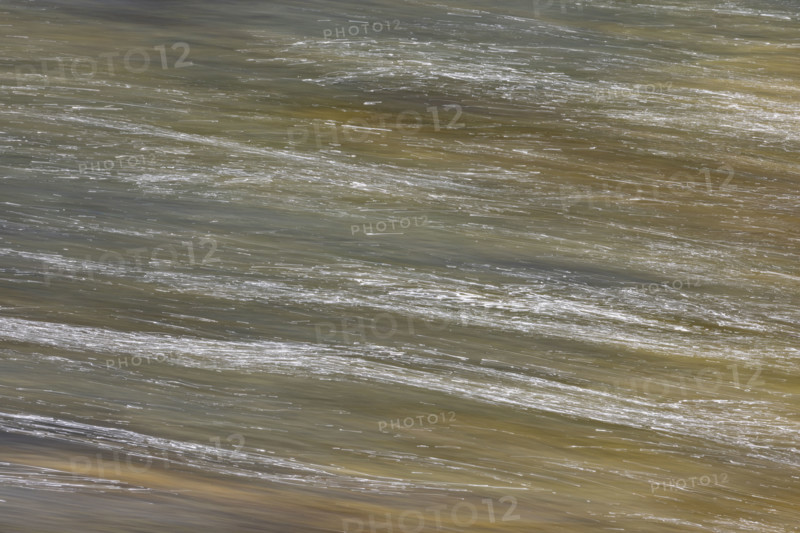 Close-up of pristine mountain creek water, motion blur