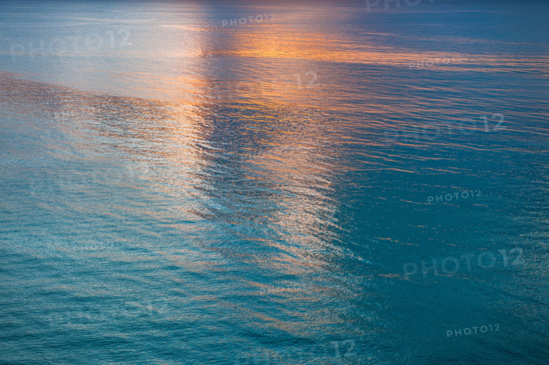 Sunlight reflected in calm water surface in morning. Boca Raton, Florida, United States