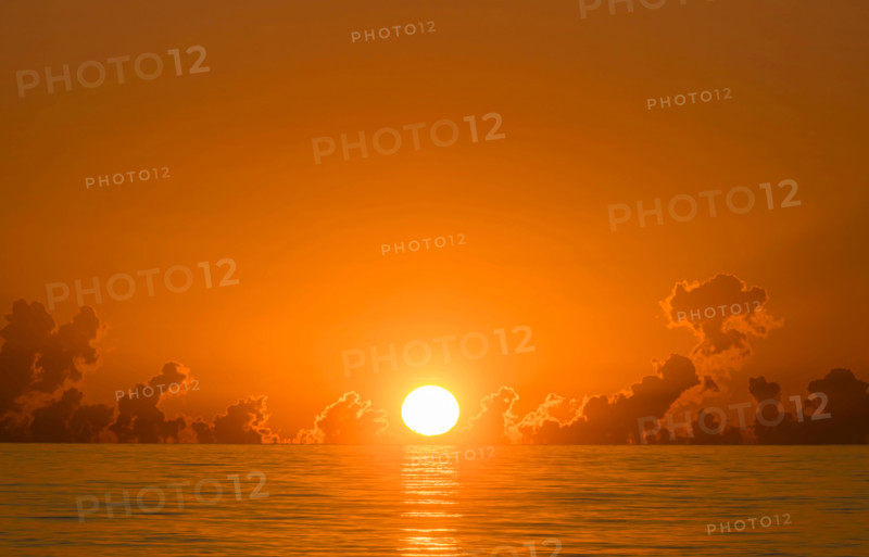 Orange sun coming up over Atlantic Ocean. Boca Raton, Florida, United States