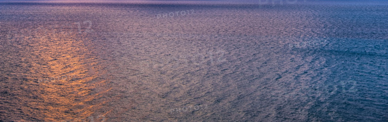Calm ocean surface reflecting sunlight at sunrise. Boca Raton, Florida, United States