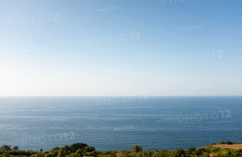 Clear sky over calm sea. San Sebastian, Gipuzkoa, Spain