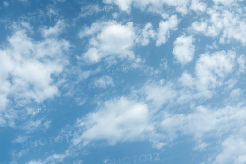 White puffy clouds against blue sky. San Sebastian, Gipuzkoa, Spain