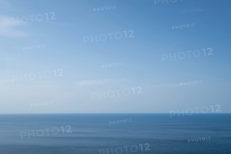 Clear blue sky above calm sea. San Sebastian, Gipuzkoa, Spain