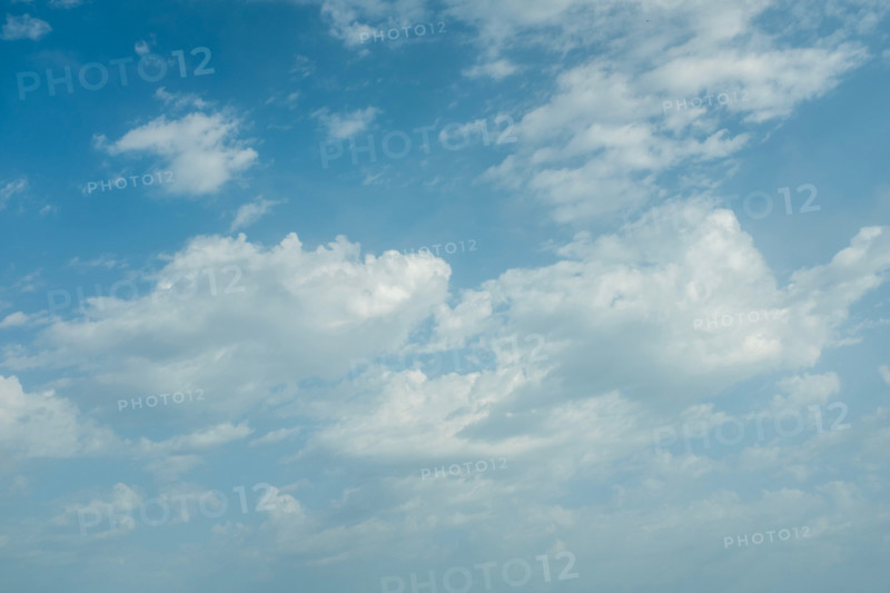 White puffy clouds against blue sky. San Sebastian, Gipuzkoa, Spain