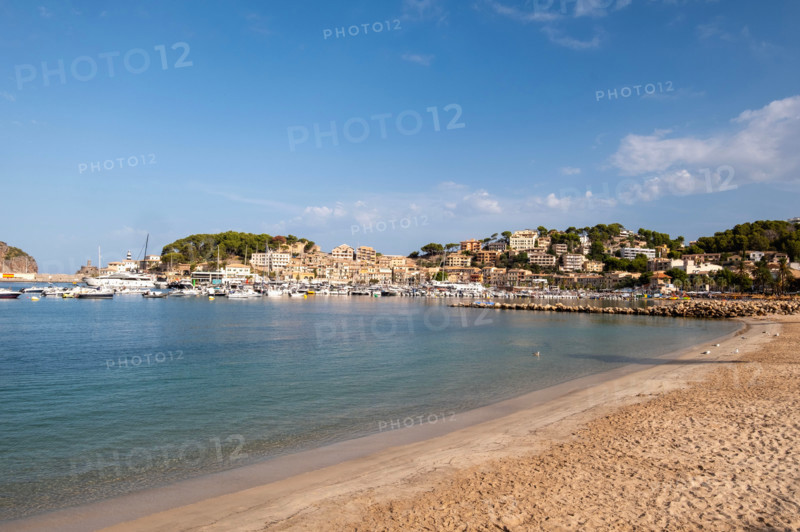 Sandy beach and old town buildings. Soller Port, Mallorca, Spain