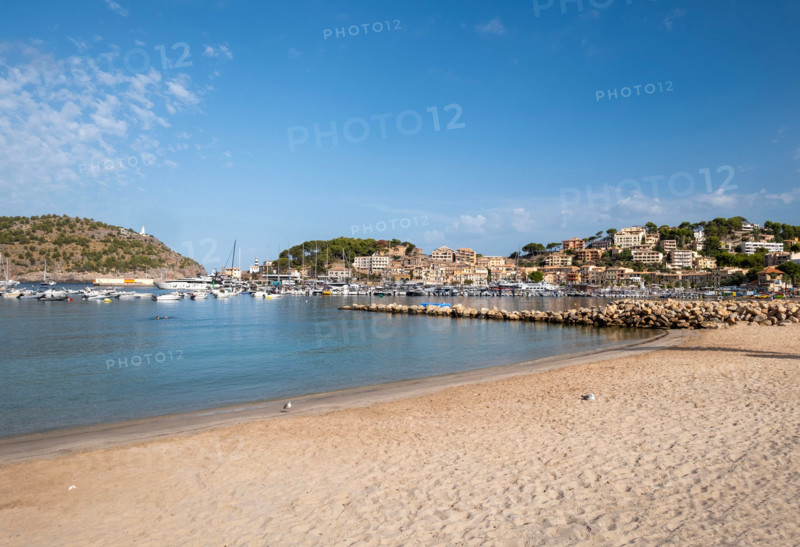 Sandy beach and old town buildings. Soller Port, Mallorca, Spain
