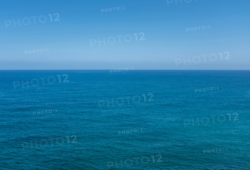 Clear blue sky over calm Bay of Biscay. Zumaia, Gipuzkoa, Spain