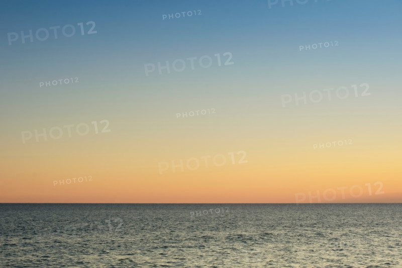 Sunset sky above calm ocean. Cape Cod, Massachusetts, United States