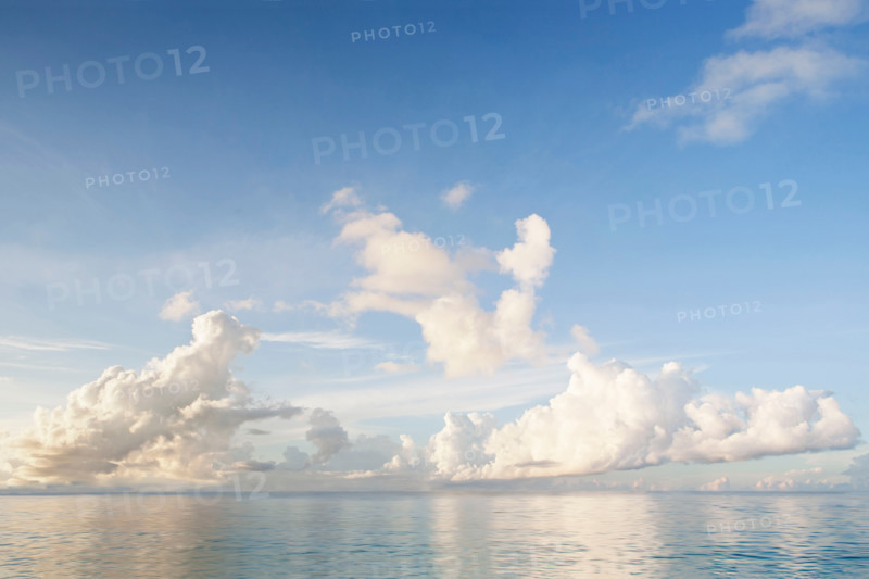 White puffy clouds above calm Caribbean Sea . St. John, United States Virgin Islands, United States