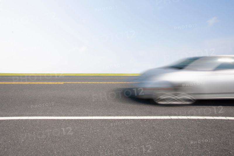 Silver sports car in motion. Chincoteague, Virginia, United States