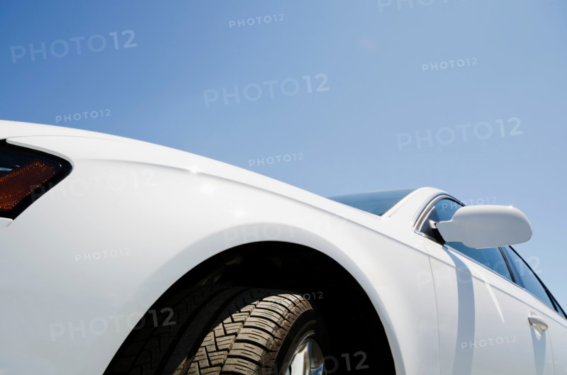 Close-up of white car and blue sky. Mendham, New Jersey, United States