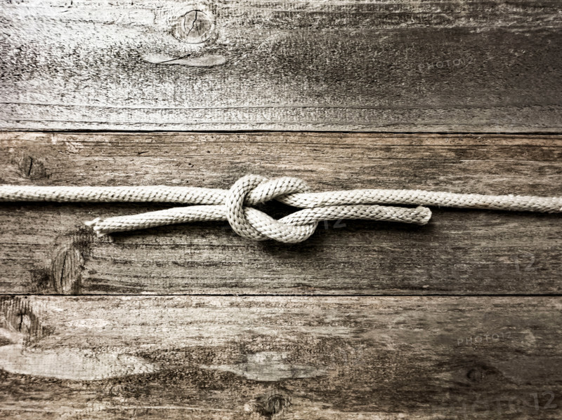 Square knot on wooden surface. Nantucket, Massachusetts, United States
