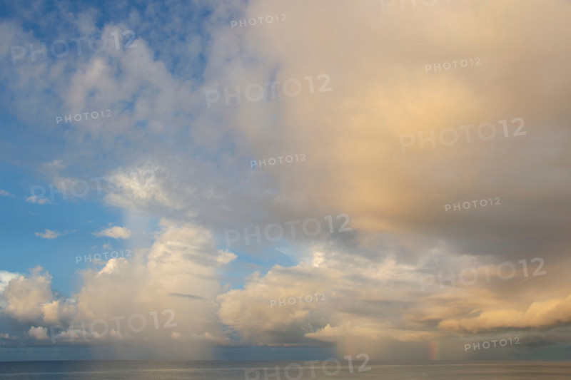 Clouds over calm gulf at sunset. St. George Island, Florida, United States