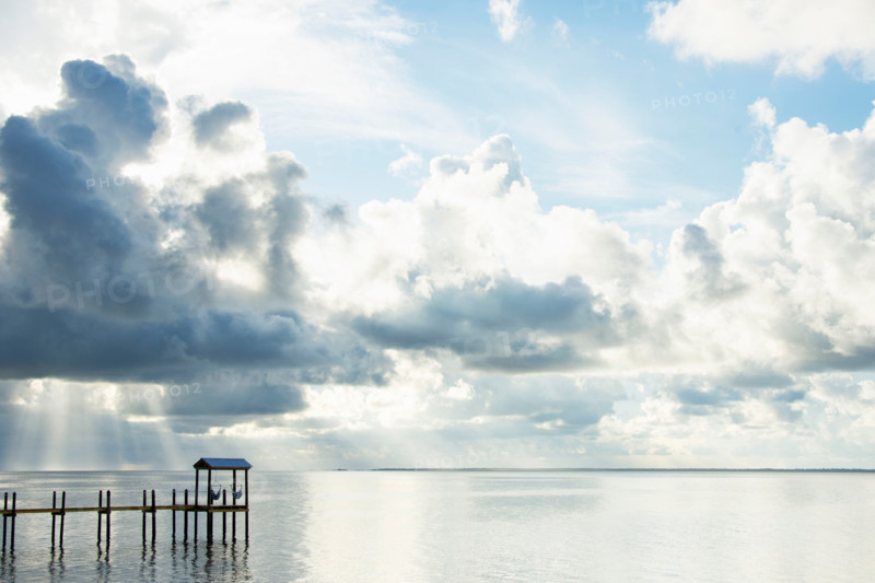 White puffy clouds over calm St. George Sound. Eastpoint, Florida, United States
