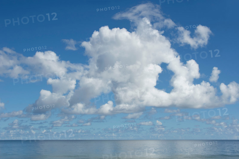 White puffy clouds above calm Apalachicola Bay. Apalachicola, Florida, United States