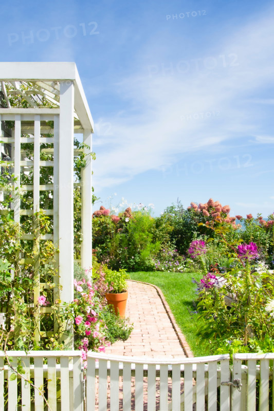 Arbor and flower garden on sunny day. Nantucket, Massachusetts, United States