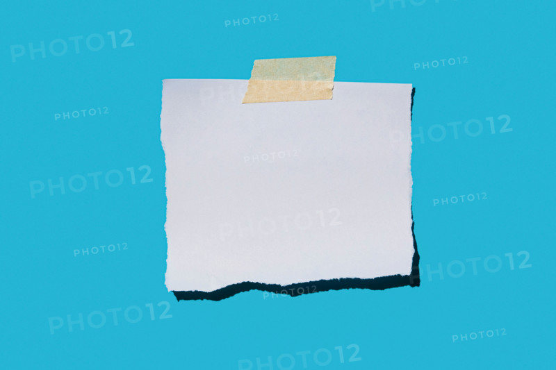 Torn blank paper on blue background. New york City, New York State, United States