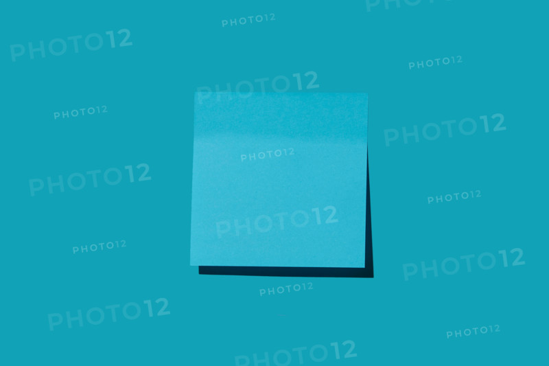 Blank blue post it note on blue background. New york City, New York State, United States