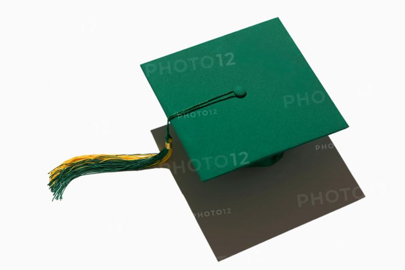 Green graduation cap on white background. New york City, New York State, United States