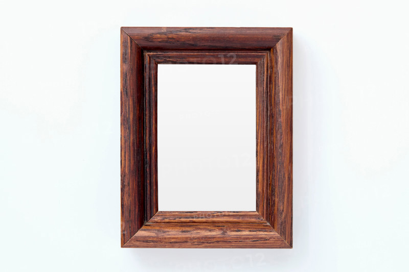 Wooden picture frame on white background. New york City, New York State, United States