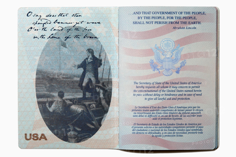 Open US passport on white background. New york City, New York State, United States