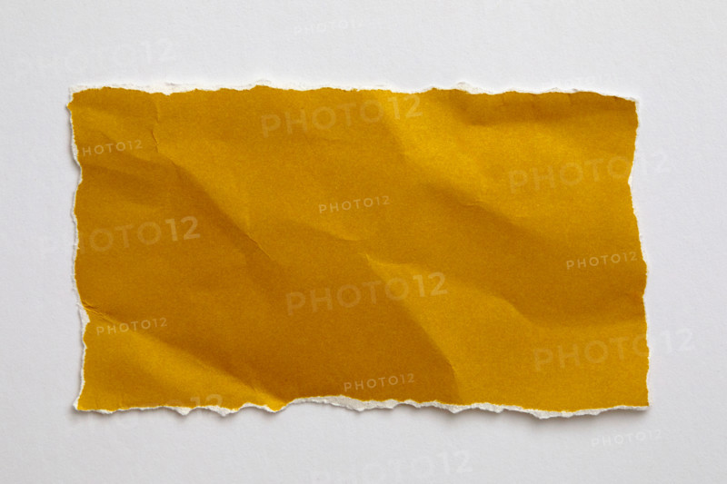 Torn yellow paper on white background. New York City, New York State, United States