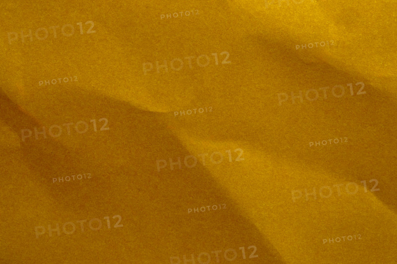 Close-up of yellow wrinkled paper. New York City, New York State, United States