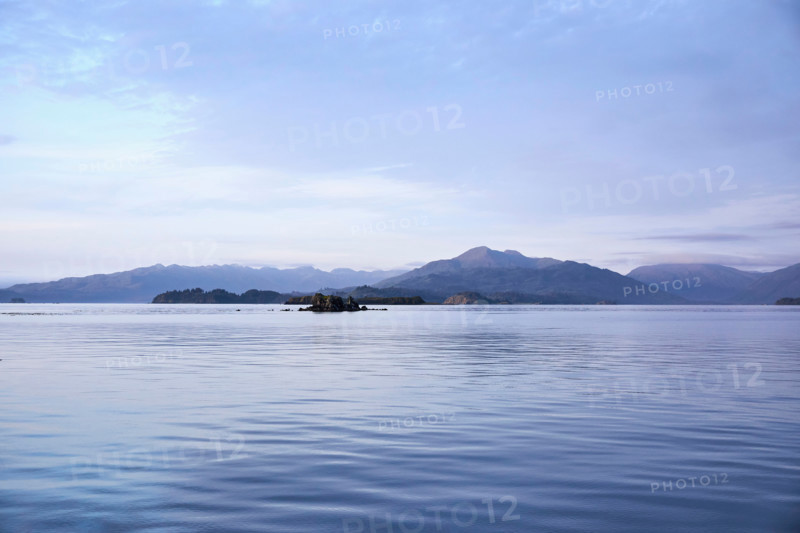 Calm ocean and Kodiak Island. Kodiak, Alaska, United States