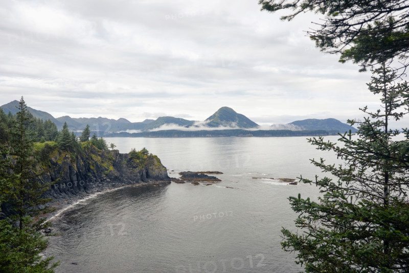 Sea coast with mountains in distance. Kodiak, Alaska, United States