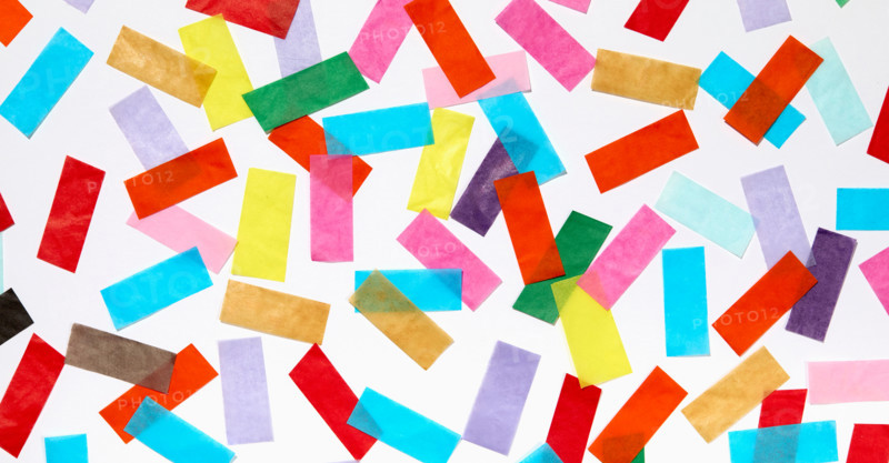 Colorful confetti on white background. New York City, New York State, United States
