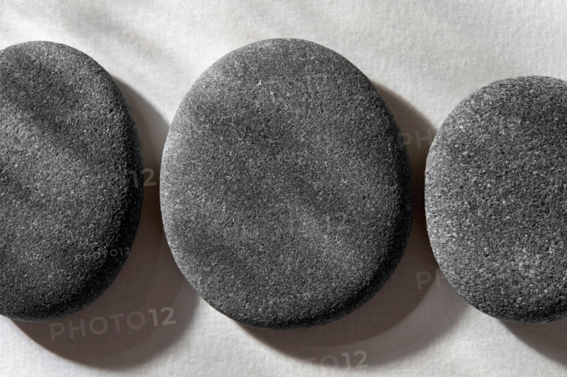 Stones on white textured background. New York City, New York State, United States