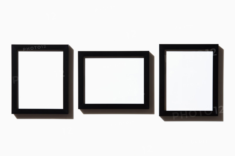 Three black picture frames on white background. New York City, New York State, United States