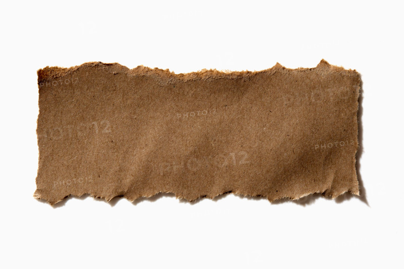 Torn craft paper on white background. New York City, New York State, United States