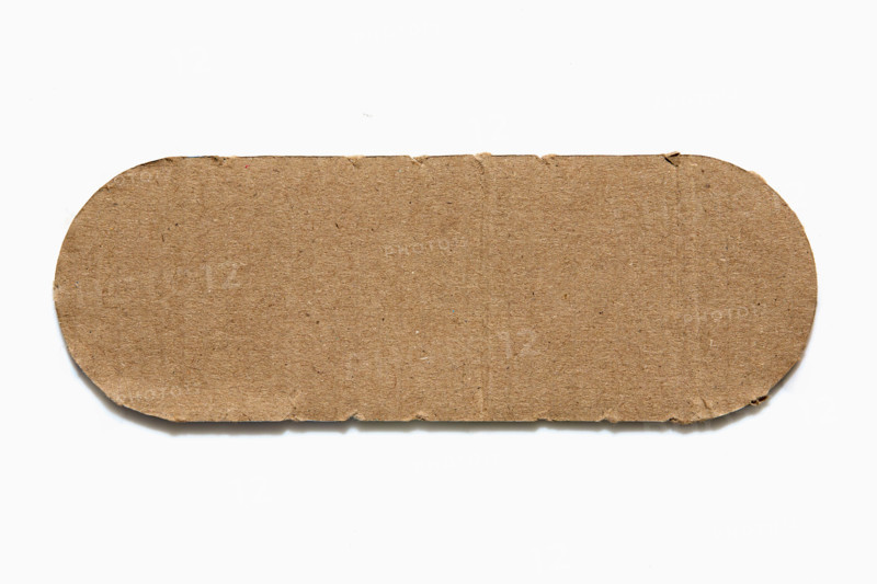 Rounded piece of cardboard on white background. New York City, New York State, United States
