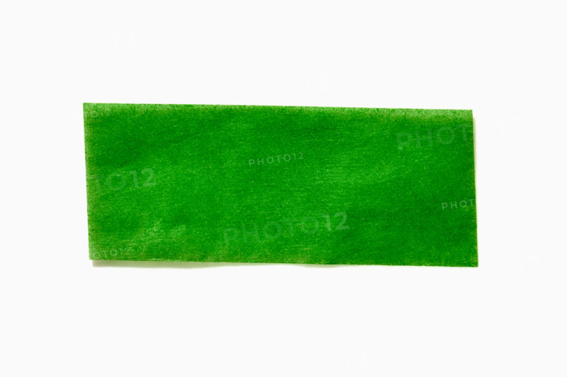 Green confetti paper on white background. New York City, New York State, United States