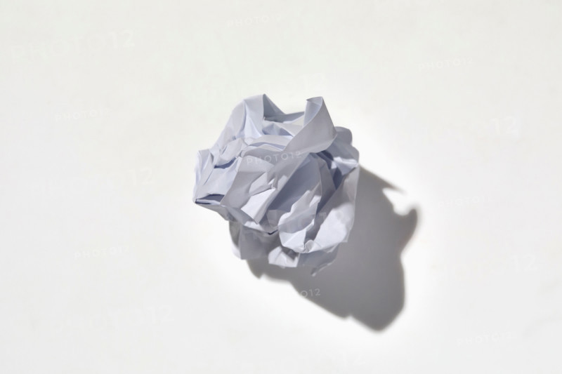 Crumpled piece of paper on white background. New York City, New York State, United States