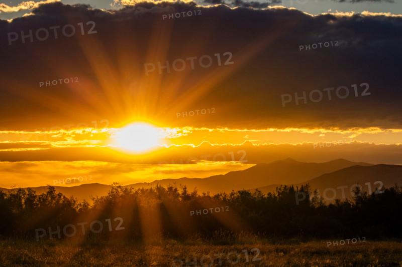 God rays over landscape at sunset. Bellevue, Idaho, United States