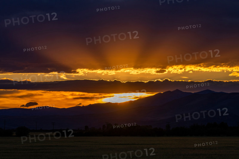 God rays over landscape at sunset. Bellevue, Idaho, United States