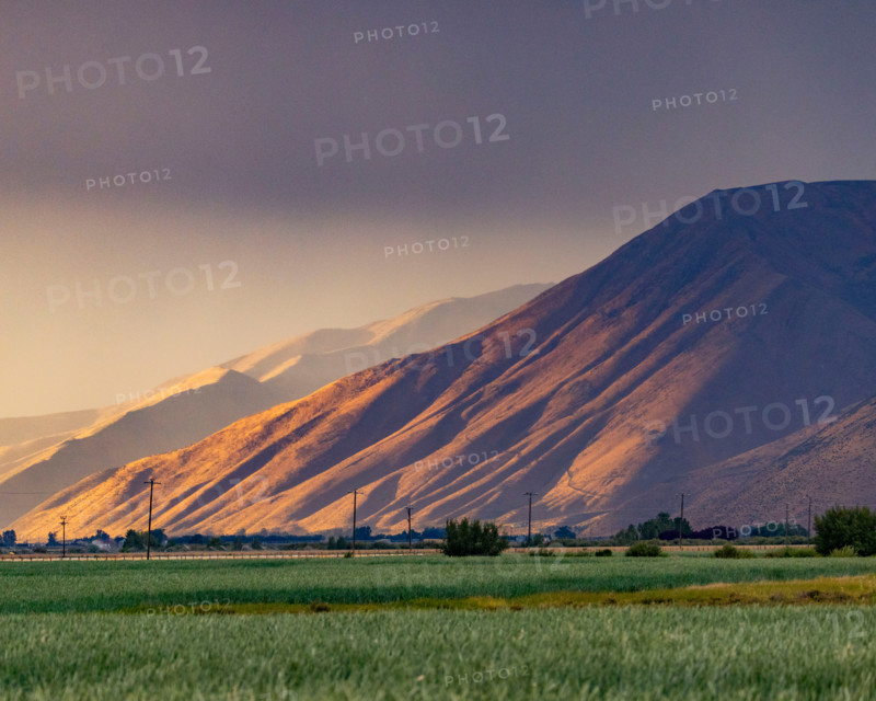 Storm clouds over hills and field. Bellevue, Idaho, United States