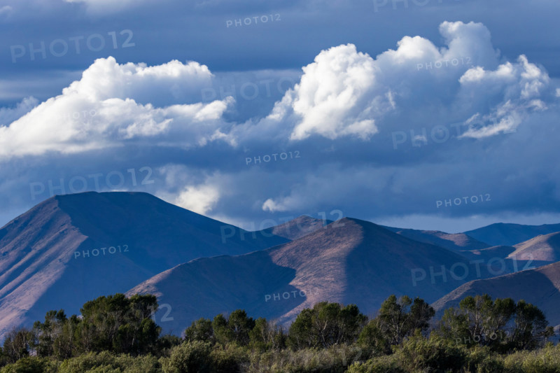 White puffy clouds above hills. Bellevue, Idaho, United States