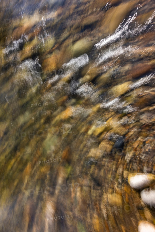 Close-up of river water and rocks, blurred motion. Bellevue, Idaho, United States