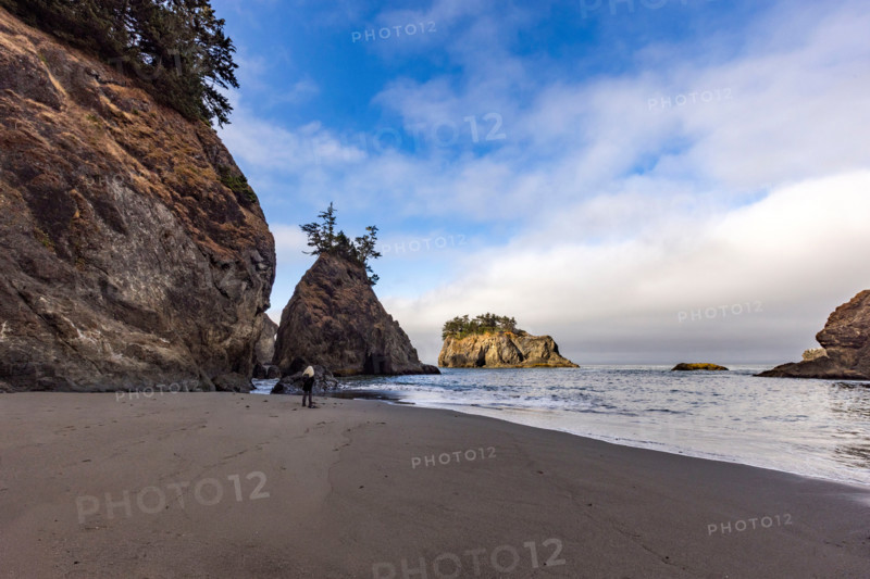 Woman on beach along Oregon Coast. Gold Beach, Oregon, United States