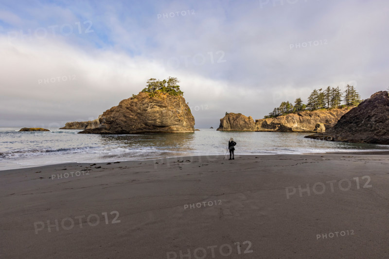 Woman on beach along Oregon Coast. Gold Beach, Oregon, United States