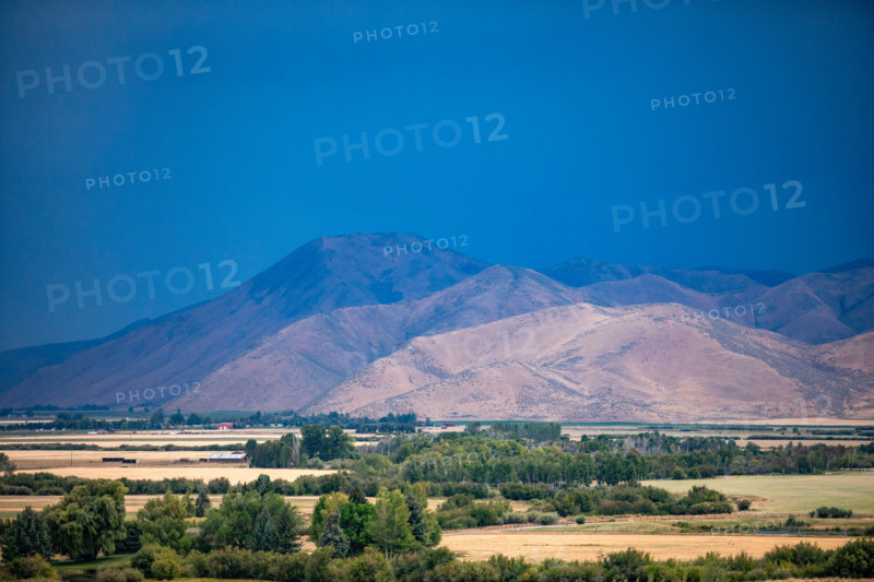 Dark storm sky over fields and hills. Bellevue, Idaho, United States