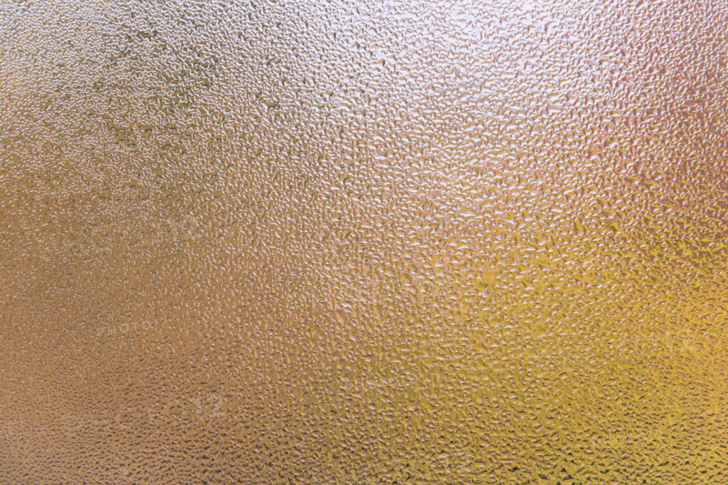 Condensation patterns on glass with warm tones. Leura, New South Wales, Australia