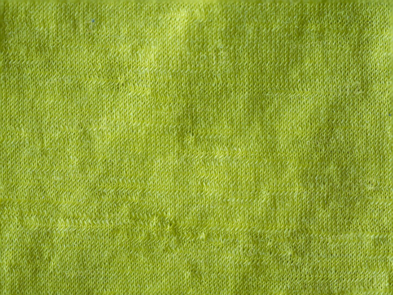 Textured detail of lime green merino wool textile. Leura, New South Wales, Australia