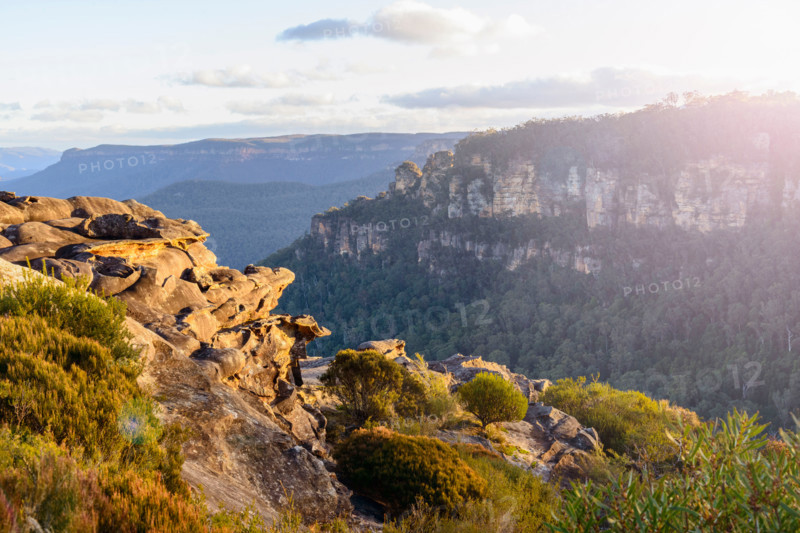 Golden sunset view of Three Sisters and Jamison Valley. Leura, New South Wales, Australia