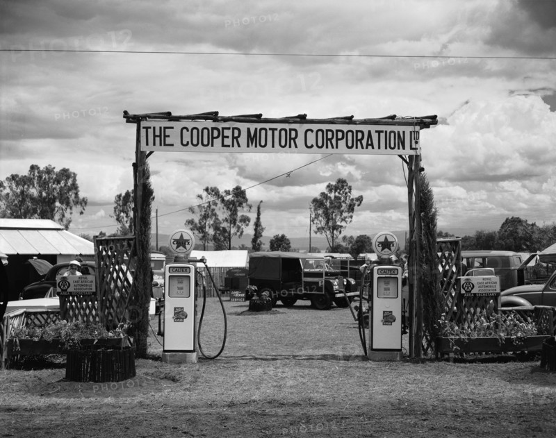 Cooper Motor Corporation. Petrol pumps at the gateway to the Cooper Motor Corporation's pitch at the Royal Show. Nakuru, Kenya, 1 October 1954. Nakuru, Rift Valley, Kenya, Eastern Africa, Africa.