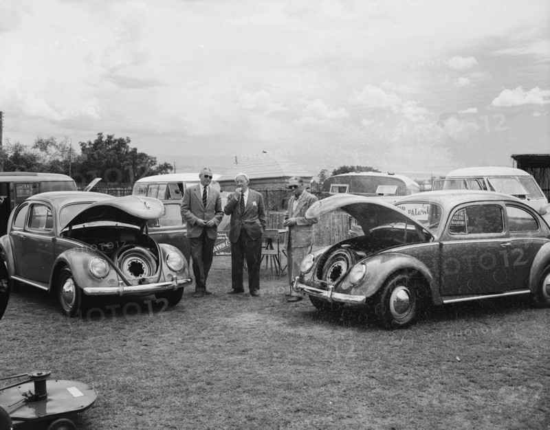 Open bonnet Beetles. Volkswagen Beetles displayed with their bonnets open at the Royal Show. The cars are on show as part of the Cooper Motor Corporation's collection. Nakuru, Kenya, 1 October 1954. Nakuru, Rift Valley, Kenya, Eastern Africa, Africa.