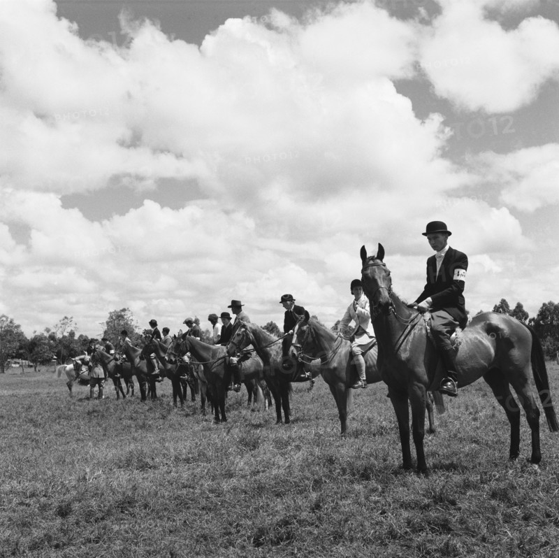 Kuwinda horse show. Seated riders in uniform line up to compete in the class 4 novice category of the Kuwinda horse show. Kuwinda, Nairobi, Kenya, 5 December 1954. Nairobi, Nairobi Area, Kenya, Eastern Africa, Africa.